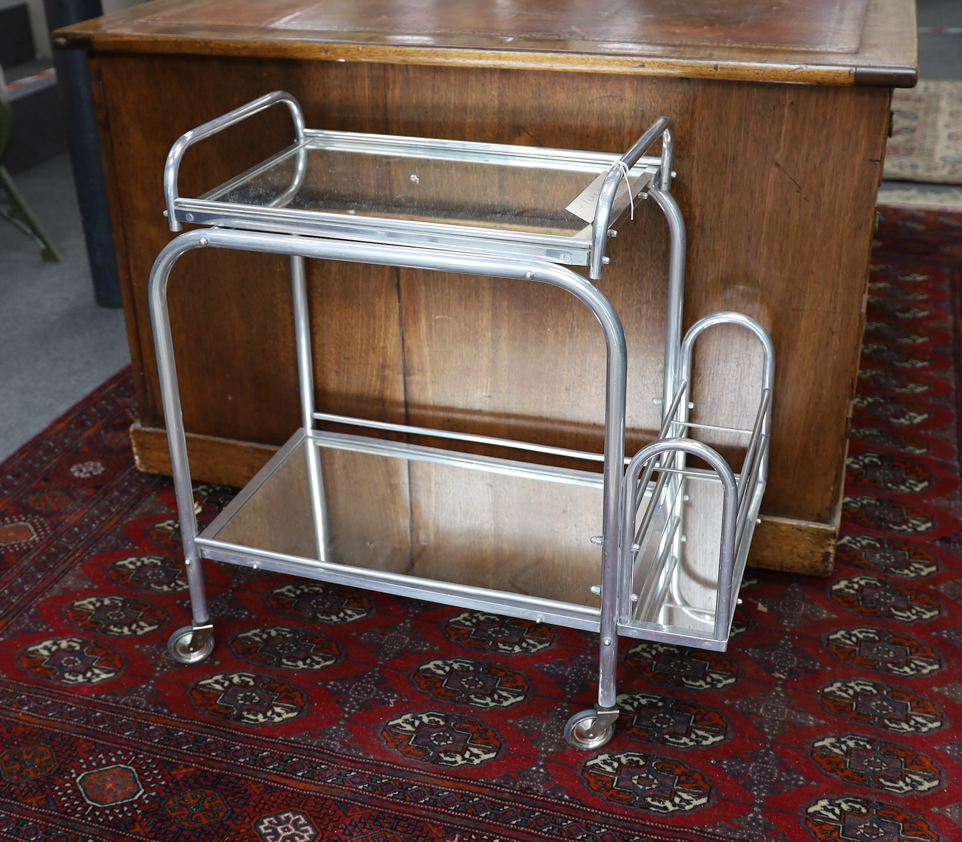 A mid century French mirrored two tiered drinks trolley, width 72cm, depth 40cm, height 72cm